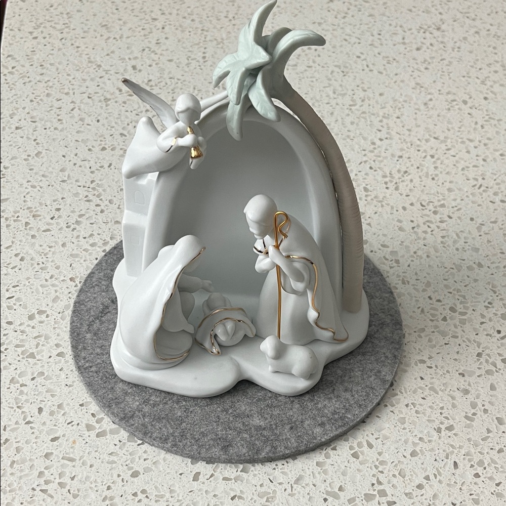 White Ceramic Nativity Sculpture with Gold Accents